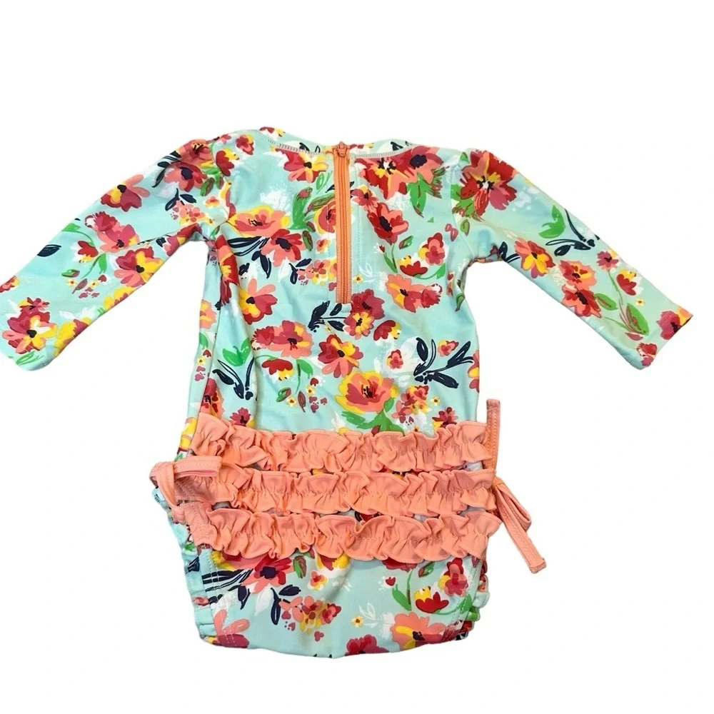 RuffleButts Painted Flowers One Piece Rash Guard Swimsuit